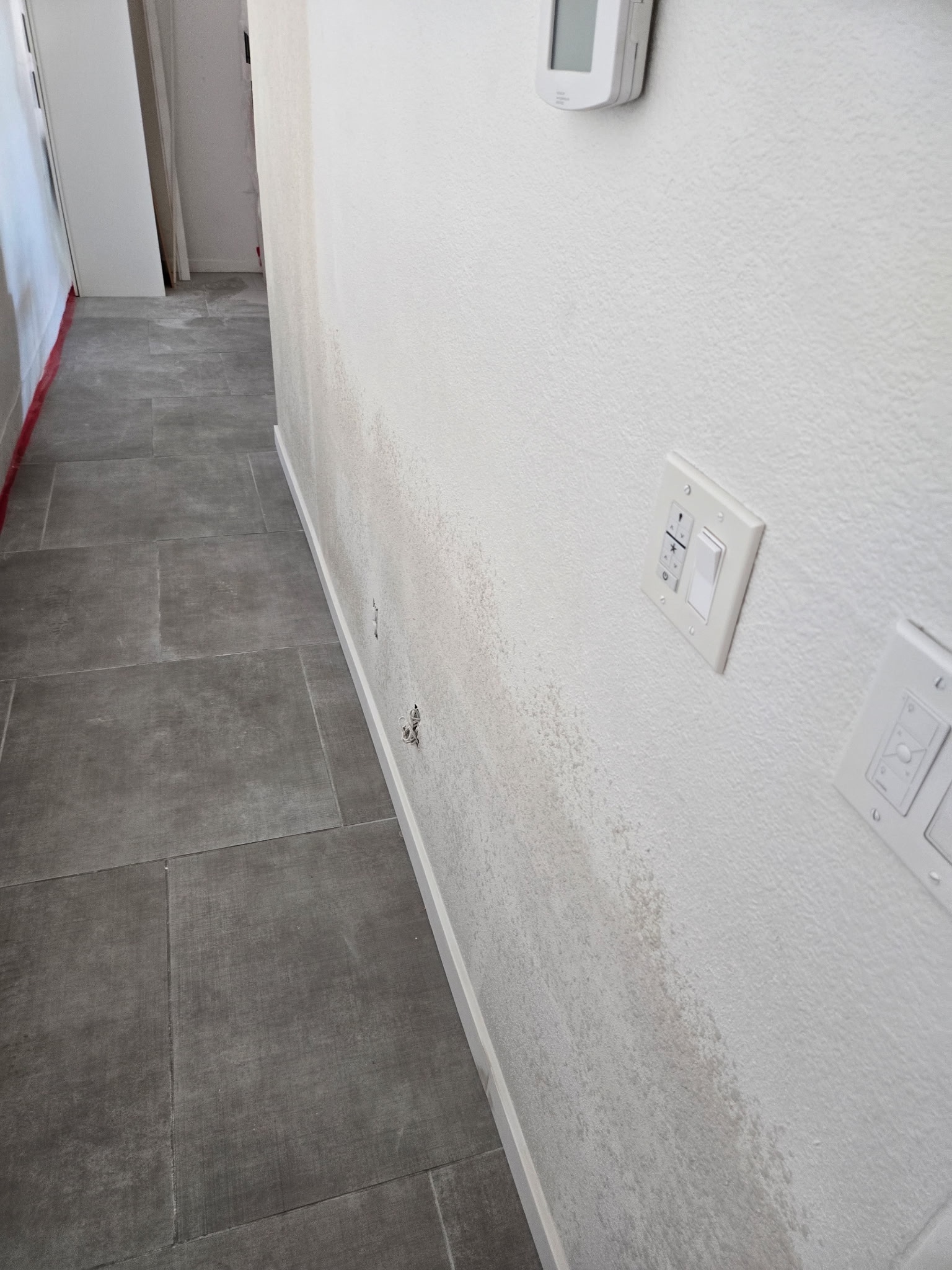 Finished textured hallway drywall repair by Cuauhtli Construction
