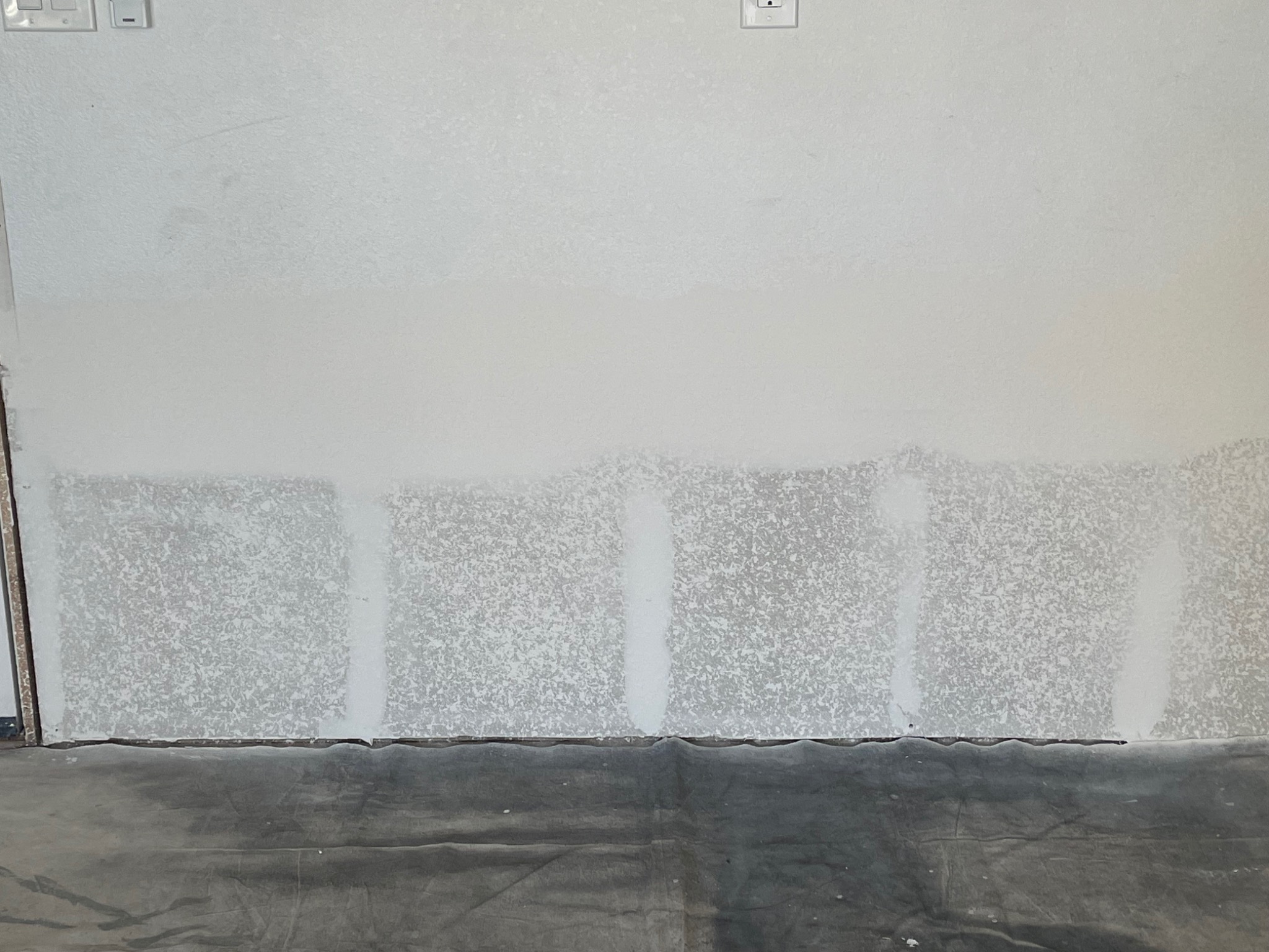 Garage drywall patches prepared for finishing