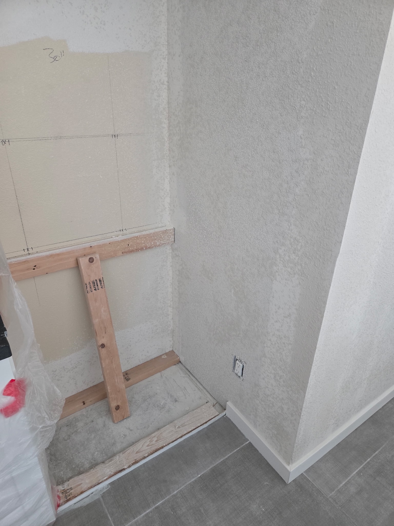 Drywall patch around a repaired wall opening